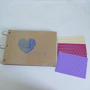 3 ring scrapbook with black paper and photo corner stickers